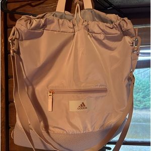Adidas rose/dusty pink convertible bag.